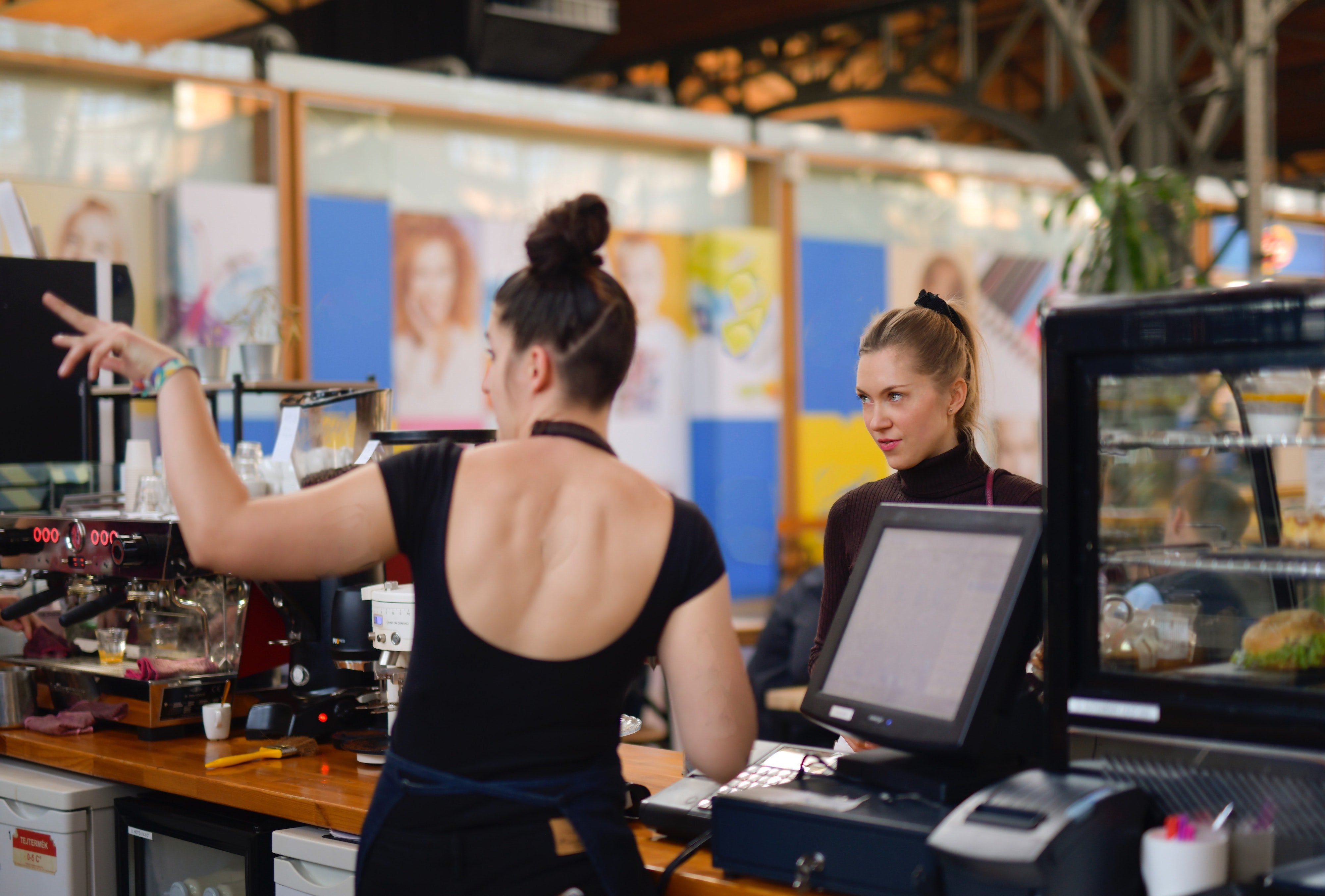 woman-in-black-top-at-the-counter-3928263